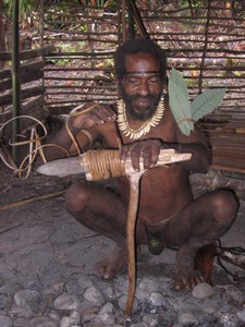 Papua Kombai – Tree people – reparation of stone axe
